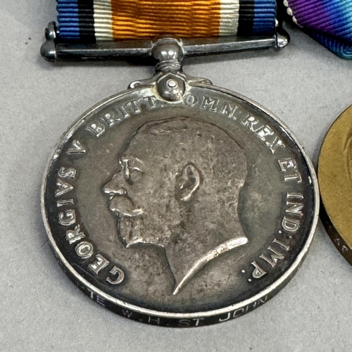 313 - First World War and Victory medals named to PTE E H St John Middlesex Regt plus Second World War def... 