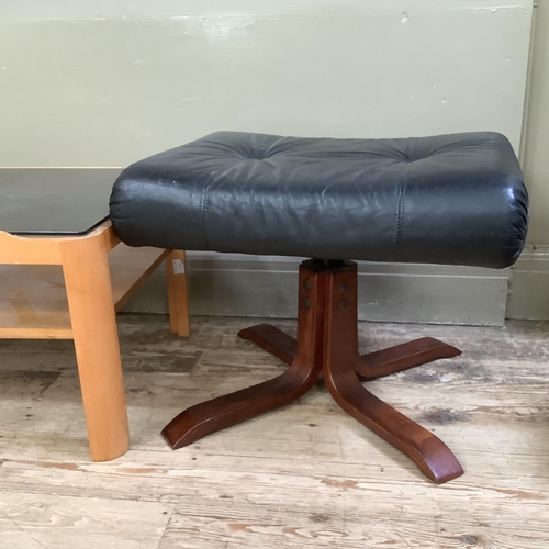 74 - A smoked glass and teak two tier coffee table 112cm x 48cm x 35cm together with a Stressless style b... 