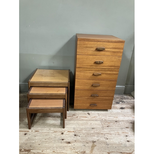 75 - A teak chest of six drawers with bar handles, 50cm x 46cm x 94cm together with a nest of three teak ... 