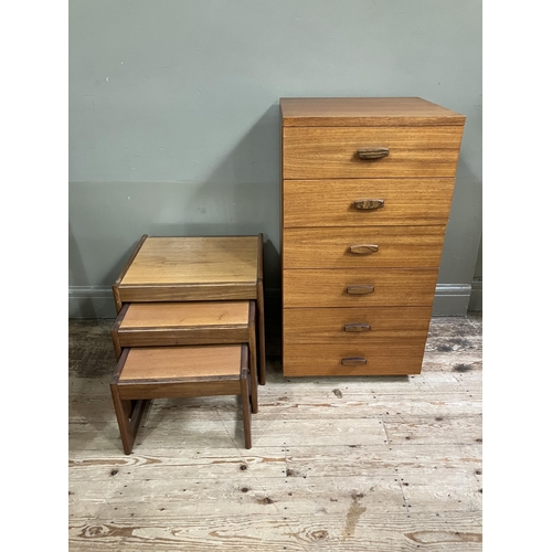 75 - A teak chest of six drawers with bar handles, 50cm x 46cm x 94cm together with a nest of three teak ... 