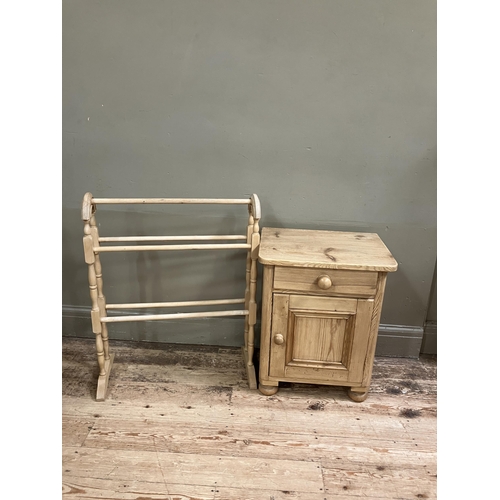 89 - A pine pot cupboard, a drawer above a single door on turned bun feet together with a pine towel rail