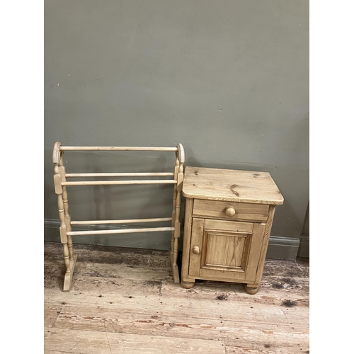 89 - A pine pot cupboard, a drawer above a single door on turned bun feet together with a pine towel rail