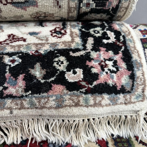 193 - A Turkish style runner, the red ground having three quatrefoil medallions within surround of stylise... 