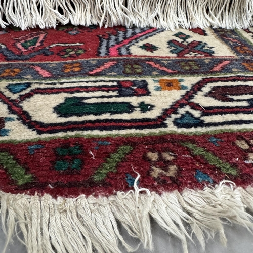 193 - A Turkish style runner, the red ground having three quatrefoil medallions within surround of stylise... 