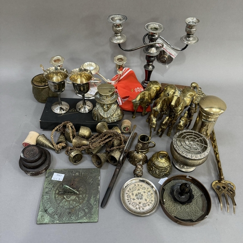 43 - A collection of brass ware including letterbox, sun dial, weights, toasting forks etc