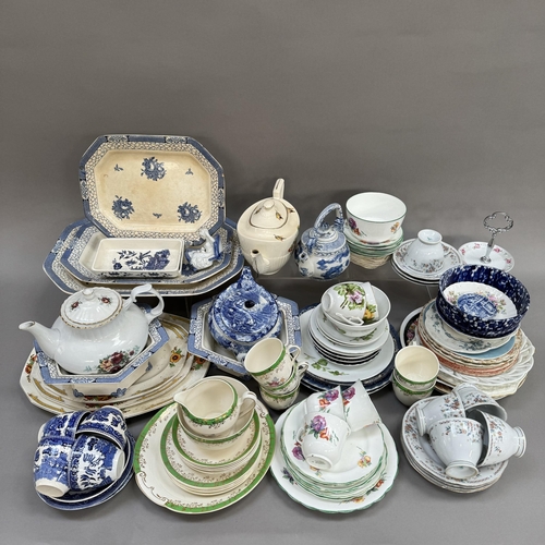 44 - A quantity of blue and white ware including cups and saucers, tea plates, dinner plates, and a Woods... 