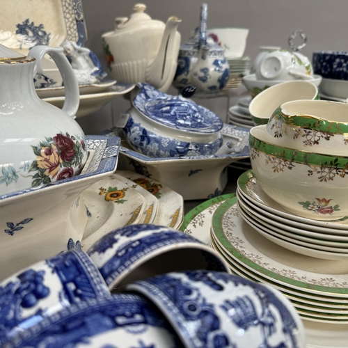 44 - A quantity of blue and white ware including cups and saucers, tea plates, dinner plates, and a Woods... 