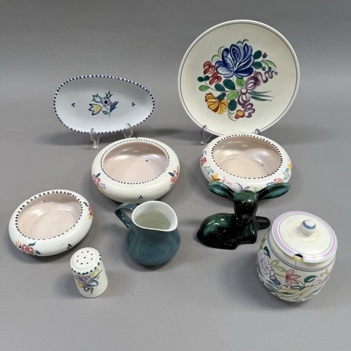 99 - A collection of Poole pottery including three posy bowls, preserve pot, cruet, cream jug and deer