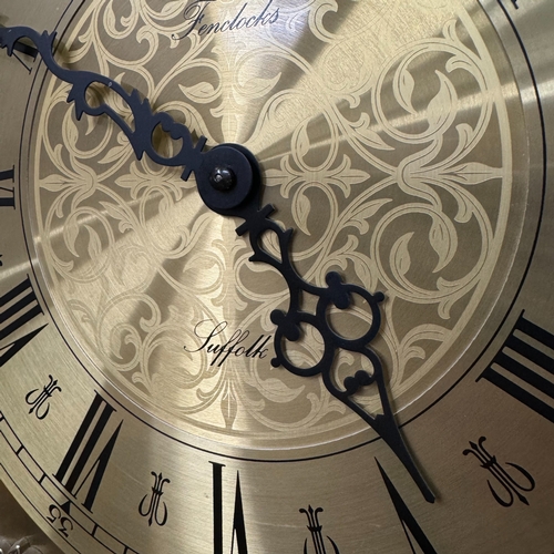 79 - A reproduction mahogany longcase clock having an arched dial with moon phase, the chaptering with Ro... 