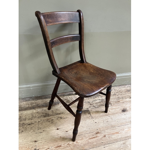 247 - A late 19th/early 20th century fruitwood kitchen chair with bar back and tie rail, saddle shaped sea... 