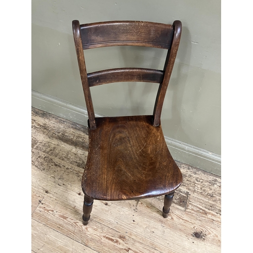 247 - A late 19th/early 20th century fruitwood kitchen chair with bar back and tie rail, saddle shaped sea... 