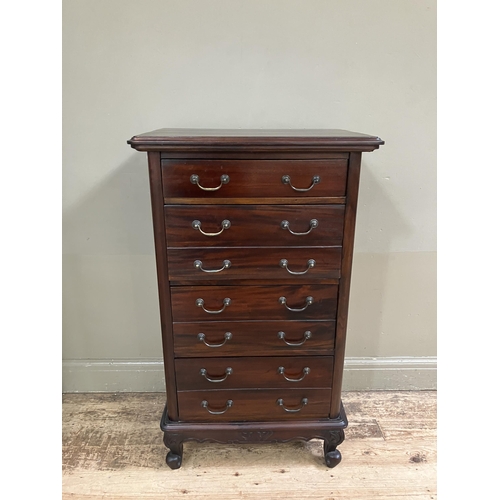 265 - A reproduction hardwood chest of one single drawer and three double fronted drawers with swing handl... 