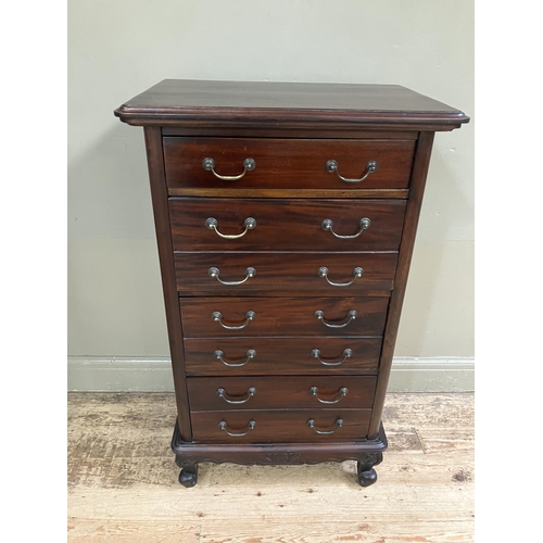 265 - A reproduction hardwood chest of one single drawer and three double fronted drawers with swing handl... 