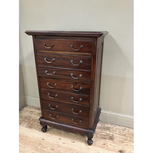 265 - A reproduction hardwood chest of one single drawer and three double fronted drawers with swing handl... 