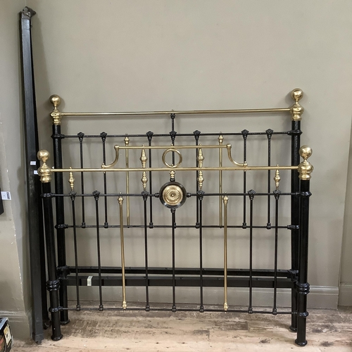 275 - A Victorian brass and iron double bedstead with gallery rail and measuring approximately 5 feet by 6... 