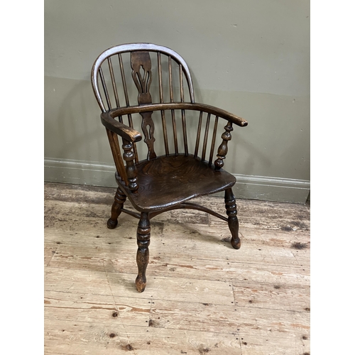 278 - A 19th century low back Windsor armchair, pierced splat and railed back joined by a crinoline stretc... 