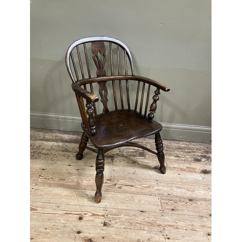 278 - A 19th century low back Windsor armchair, pierced splat and railed back joined by a crinoline stretc... 