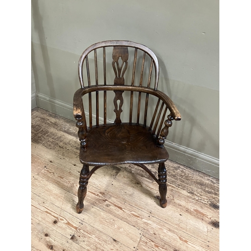 278 - A 19th century low back Windsor armchair, pierced splat and railed back joined by a crinoline stretc... 