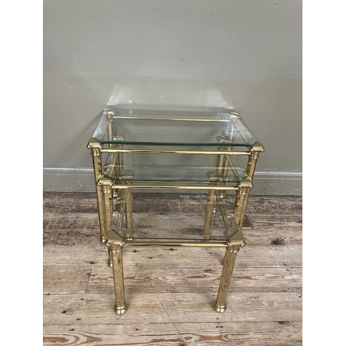 282 - A set of three brass and glass coffee tables