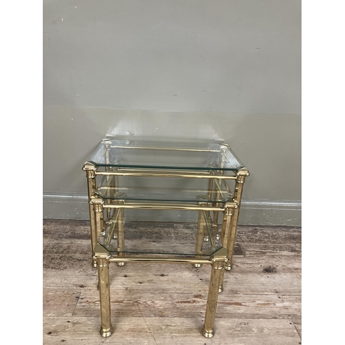 282 - A set of three brass and glass coffee tables