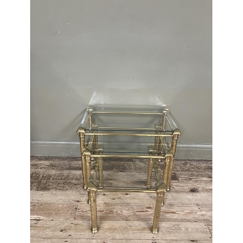 282 - A set of three brass and glass coffee tables