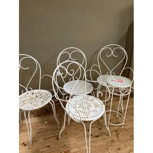 222 - A set of four vintage wire work chairs and a similar table with rose decorated top