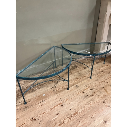 225 - A pair of conservatory green metal demi-lune conservatory tables with glass inset service and on str... 