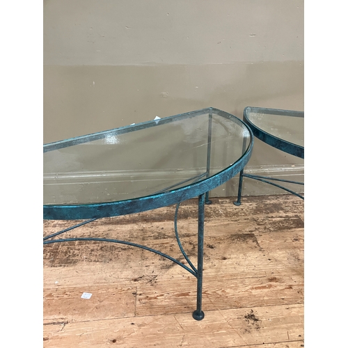 225 - A pair of conservatory green metal demi-lune conservatory tables with glass inset service and on str... 