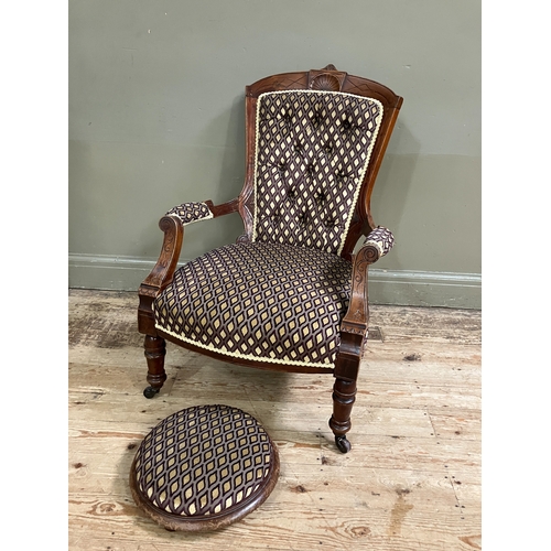 289 - A late Victorian open armchair having an encircling frame with shell cresting, button upholstered ba... 