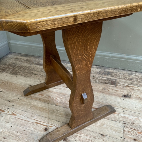 290 - A small oak refectory table on shaped standards joined by a stretcher, 70cm x 64cm x 70cm