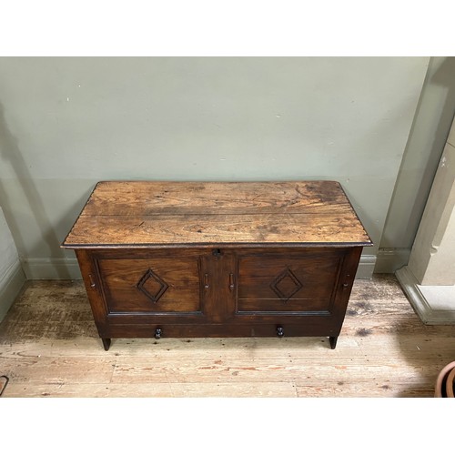 300 - A 19th century oak kist having a twin indented panel front with diamond motifs on panel shaped sides... 