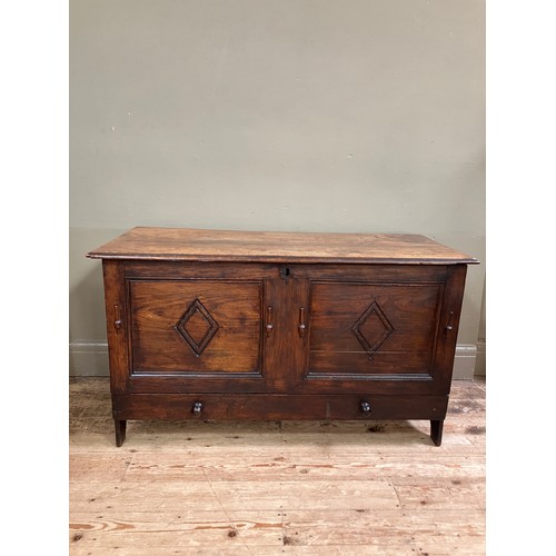 300 - A 19th century oak kist having a twin indented panel front with diamond motifs on panel shaped sides... 