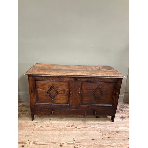 300 - A 19th century oak kist having a twin indented panel front with diamond motifs on panel shaped sides... 