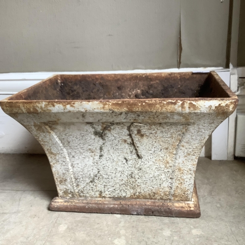 227 - A cast iron planter of rectangular outline and flared profile, 40cm x 28cm x 25cm