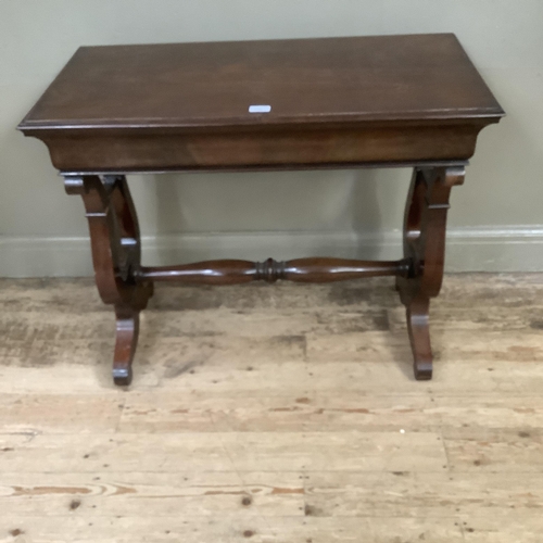 236 - A mahogany rectangular side table on lyre shaped supports and with refectory supports and turned str... 