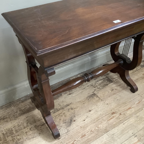 236 - A mahogany rectangular side table on lyre shaped supports and with refectory supports and turned str... 