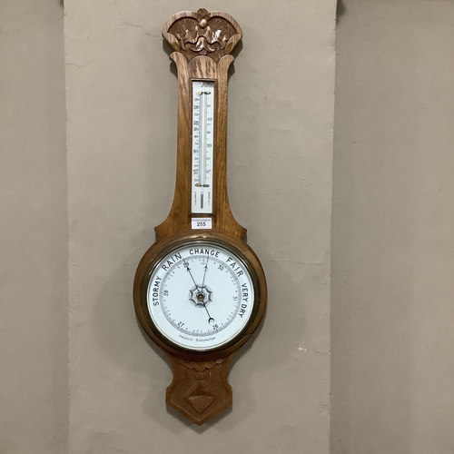 255 - A 20th century oak aneroid banjo barometer, 79cm high