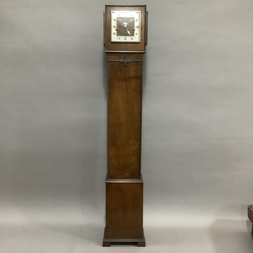 258 - A 1930s oak cased grandmother clock, the square silvered chaptering with black Arabic numerals, eigh... 