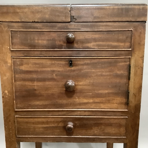 262 - A 19th century mahogany night table having a twin fold out top, later inset board, dummy drawer abov... 