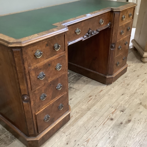 272 - A Victorian figured walnut desk converted from a dressing table having a faux leather writing surfac... 