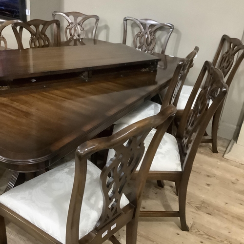 292 - A Rackstraw dining room suite comprising extending dining table on twin pedestals each with three do... 