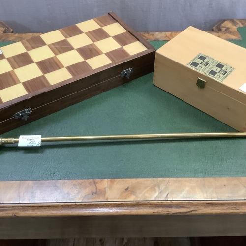 302 - A game box with chequered outer surface, the interior lined in green baize together with a set of ch... 