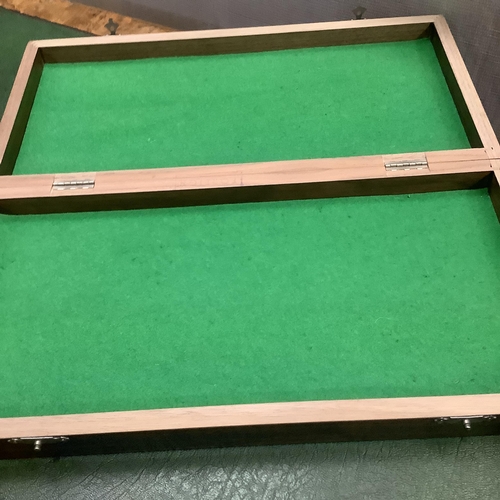 302 - A game box with chequered outer surface, the interior lined in green baize together with a set of ch... 