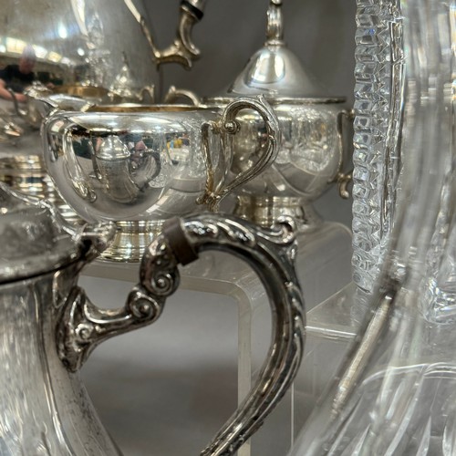 131 - A three piece silver plated tea service and similar coffee pot, silver plated and glass wine server ... 