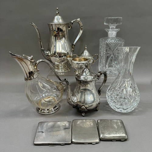 131 - A three piece silver plated tea service and similar coffee pot, silver plated and glass wine server ... 