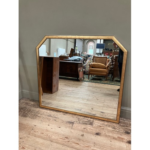 263 - A gilt framed wall mirror with canted corners to the top, 110cm x 120cm