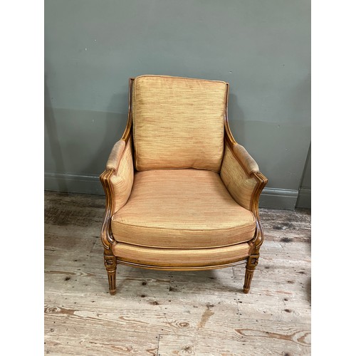 286 - An early 19th century style fruitwood and bergere caned armchair having a square back, upholstered a... 