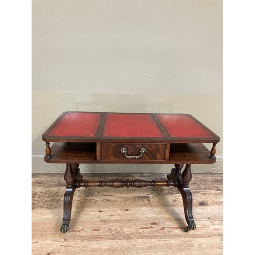 250 - A mahogany and red leather incised coffee table having an under tier with drawer on turned refectory... 