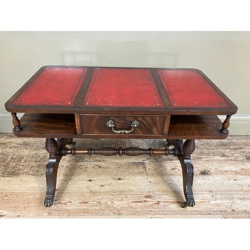 250 - A mahogany and red leather incised coffee table having an under tier with drawer on turned refectory... 