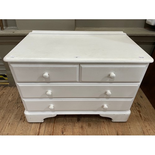 87 - A white painted, possibly pine, chest of two short over two long drawers on bracket feet, 88cm x 45c... 